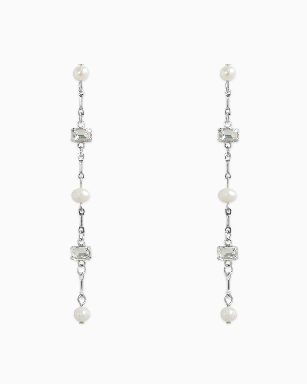 Sessori linear drop earrings featuring freshwater pearls and clear baguette stones on silver chain