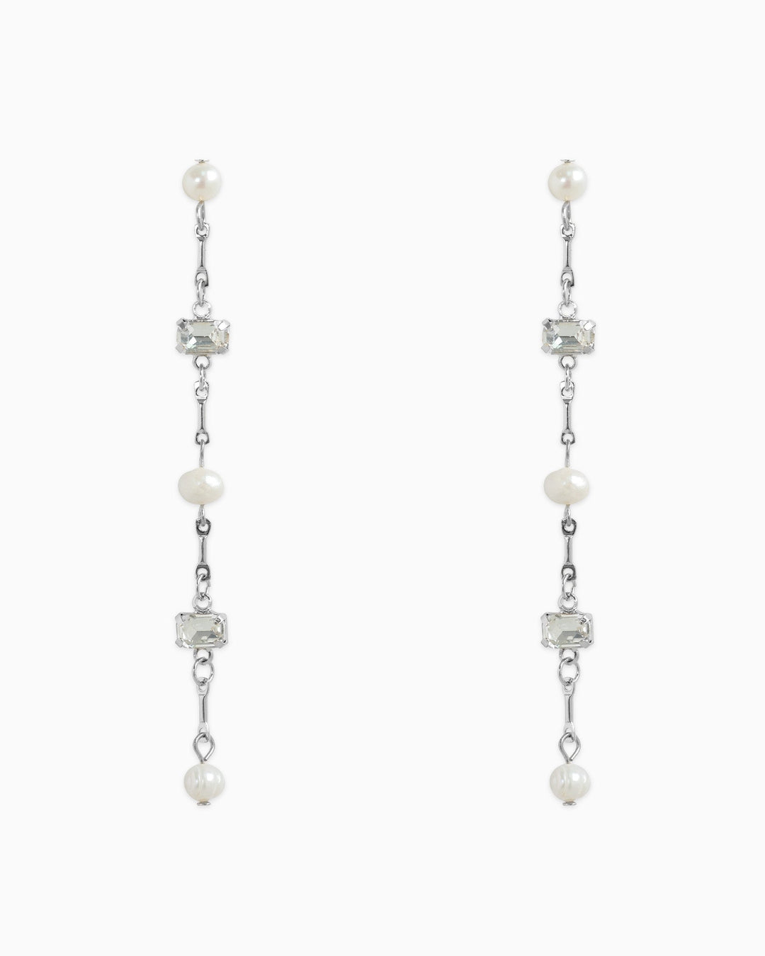 Sessori linear drop earrings featuring freshwater pearls and clear baguette stones on silver chain