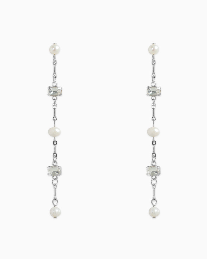 Sessori linear drop earrings featuring freshwater pearls and clear baguette stones on silver chain