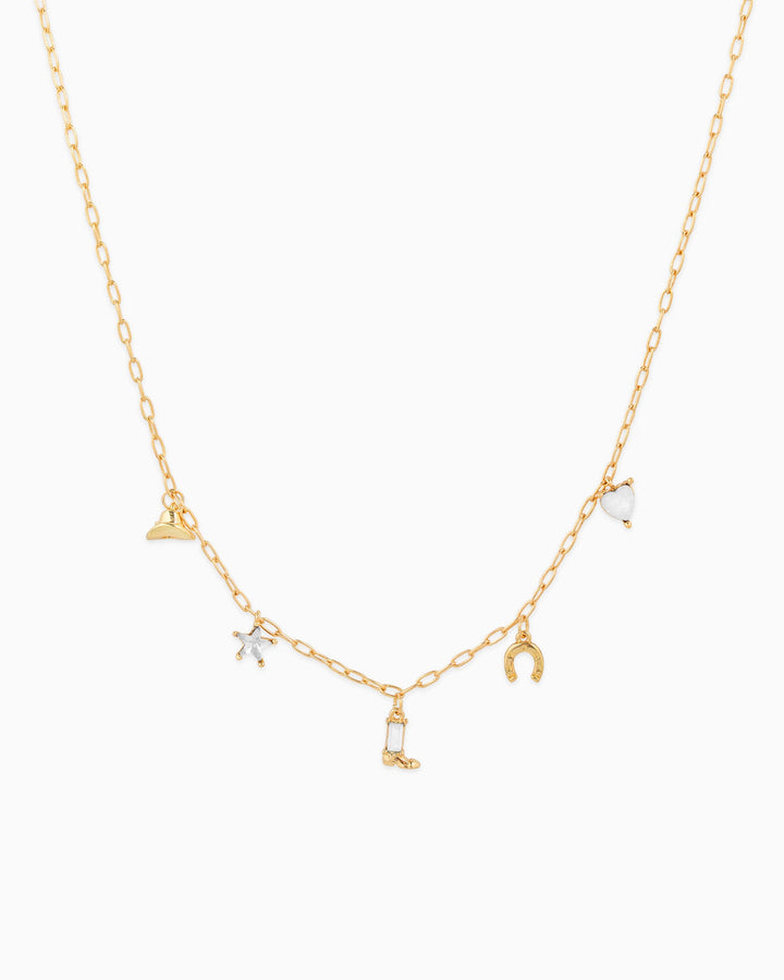 Gold chain western charm necklace featuring cowboy hat, star, boot, horseshoe, and heart charms
