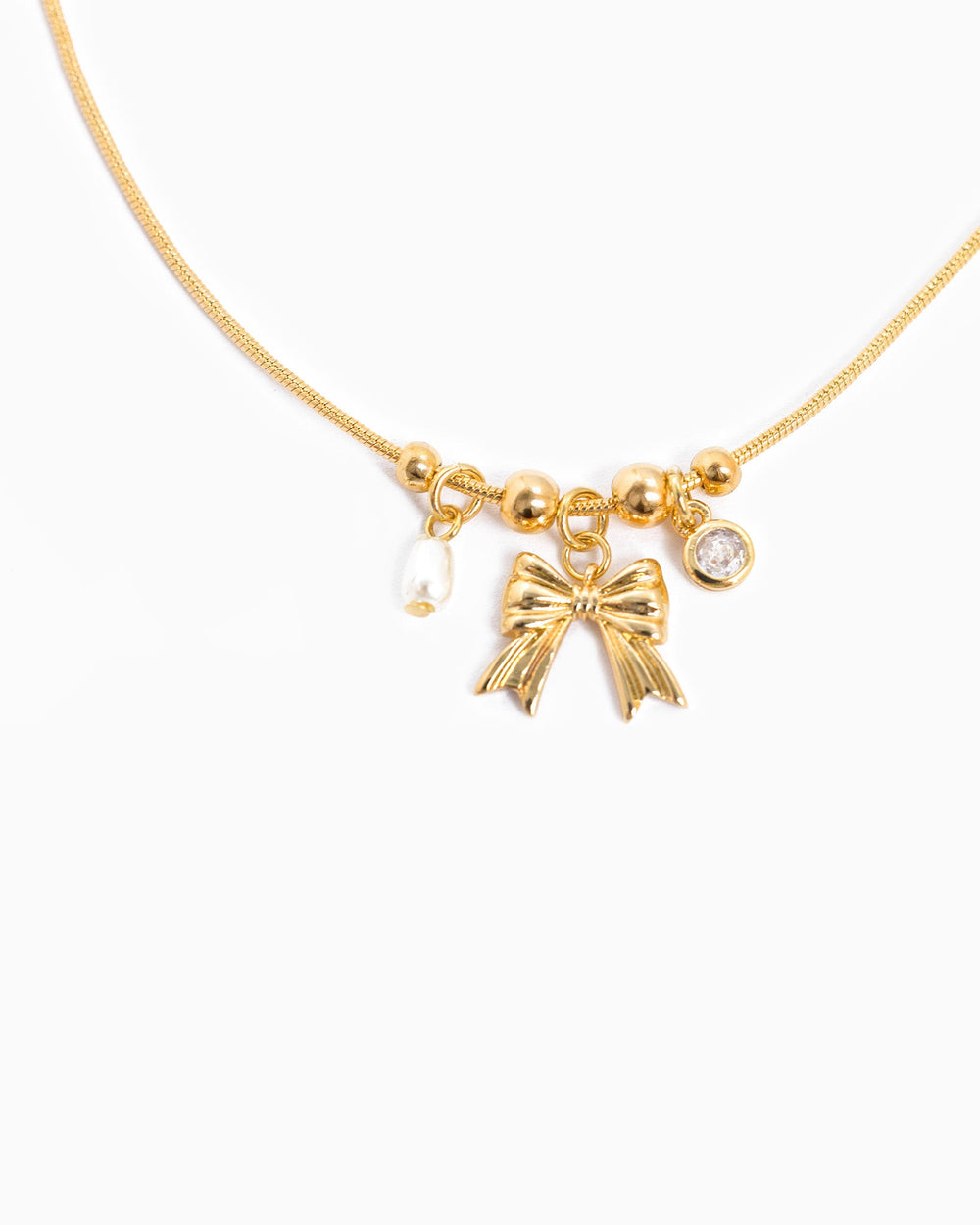 Sessori gold dainty necklace with bow charm, small pearl, and crystal pendant