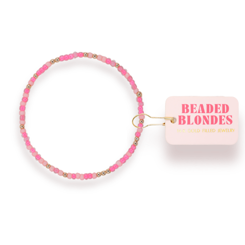 Beaded Blondes Flamingo Sprinkle Bracelet with pink and gold beads on mauve silicone bangle