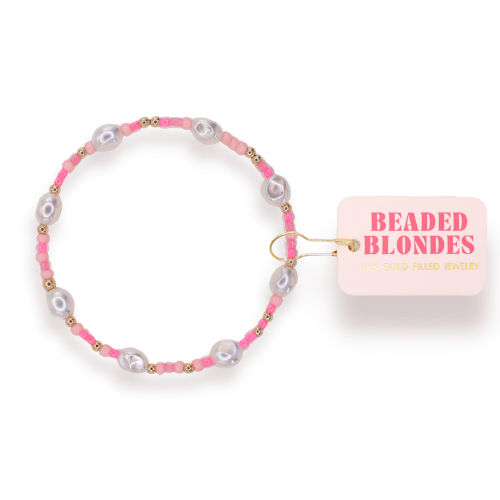 Beaded Blondes Flamingo Sprinkle Bracelet featuring pink, pearl, and gold beads with brand tag