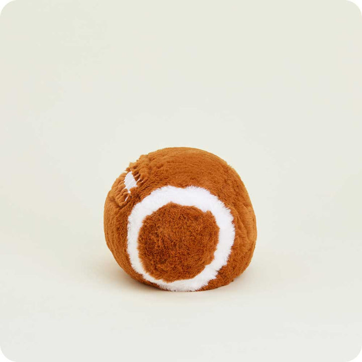 Warmies brown and white football-shaped plush toy on clean white background