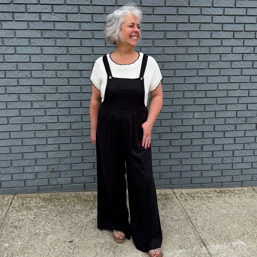 Chic piece with front pockets and adjustable straps—runs slightly small, perfect for stylish women 30+ with confident flair.