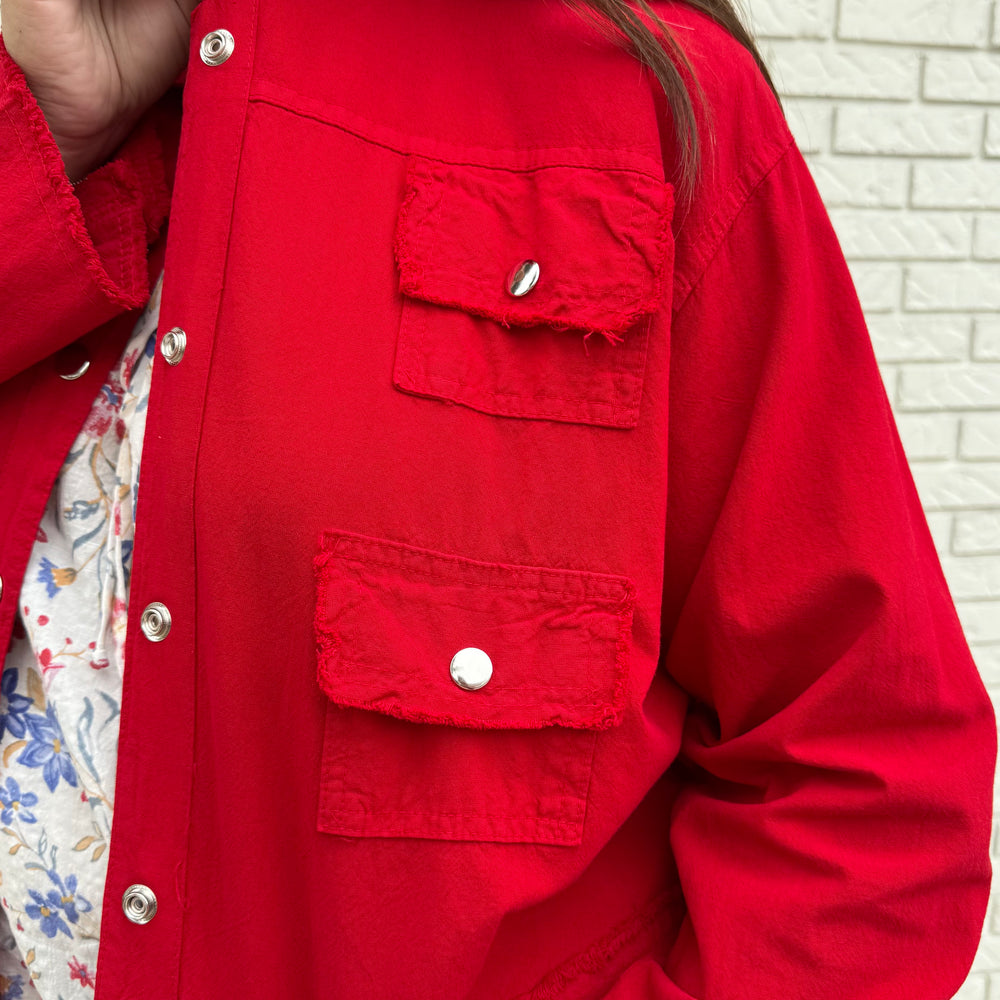 Cropped linen jean-style jacket with raw hem—fun, true-to-size layer for effortlessly stylish women 30+.









