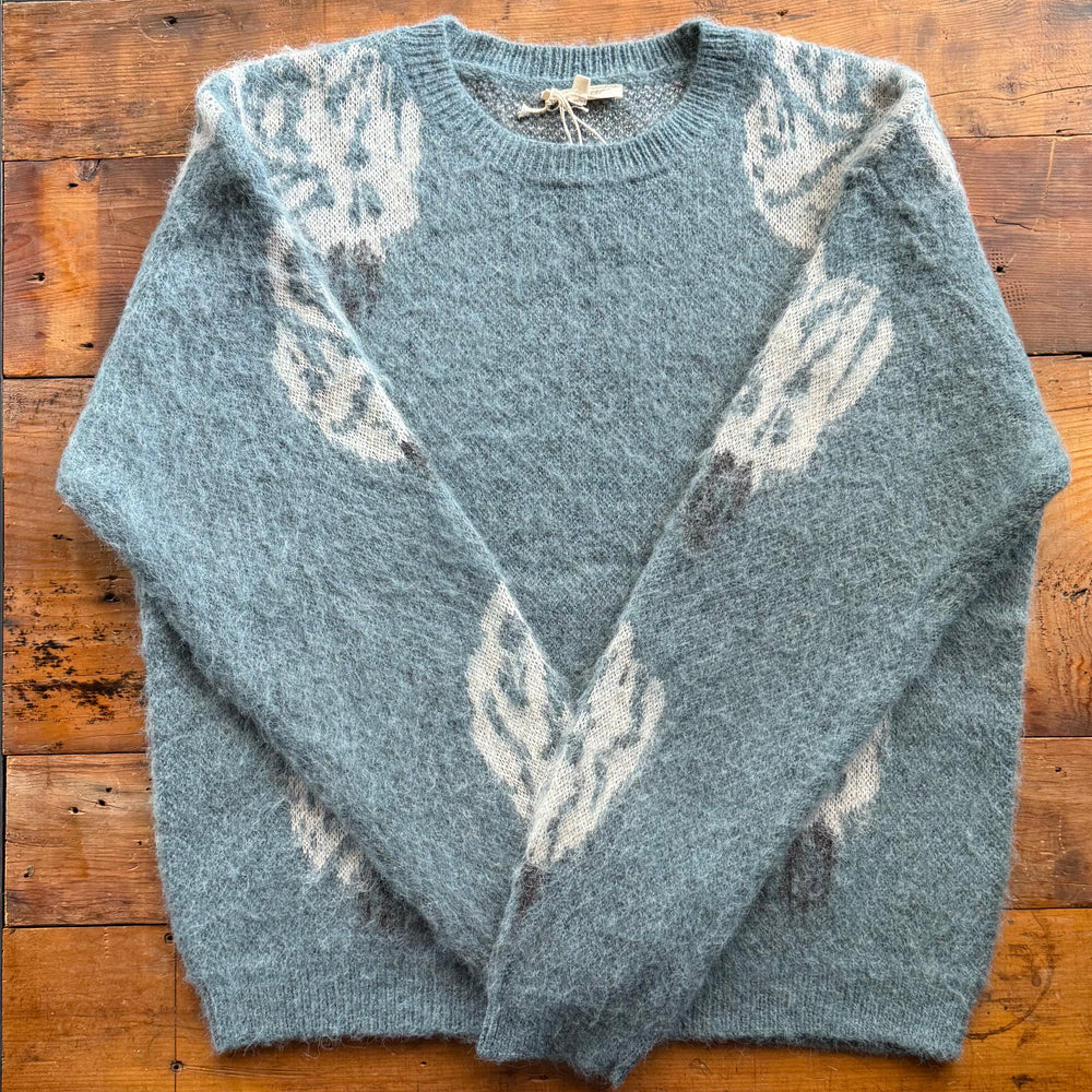 Women's loose-fit round neck top with ribbed knit lining – cozy and casual style.

