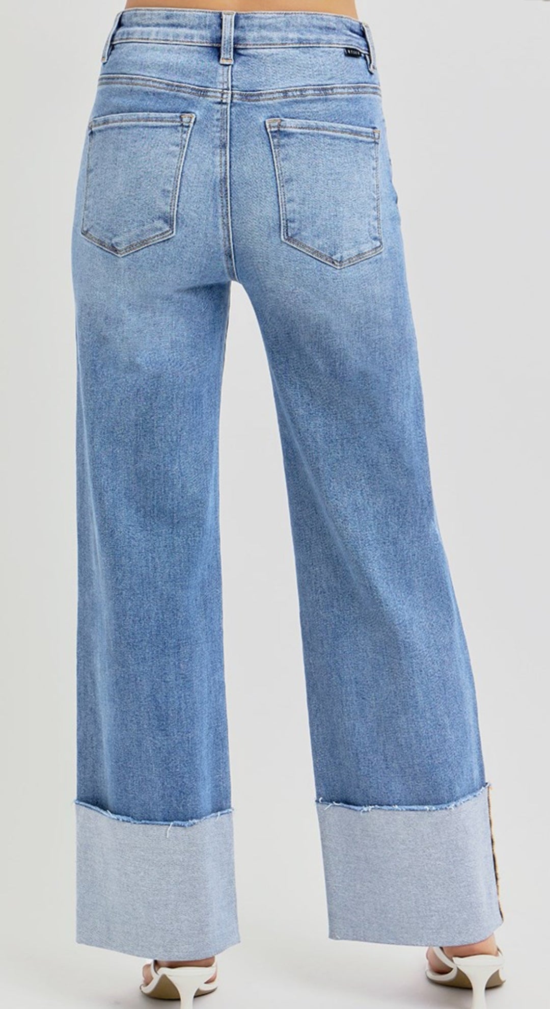 High rise wide leg jeans with cuffed ankles in medium blue denim wash