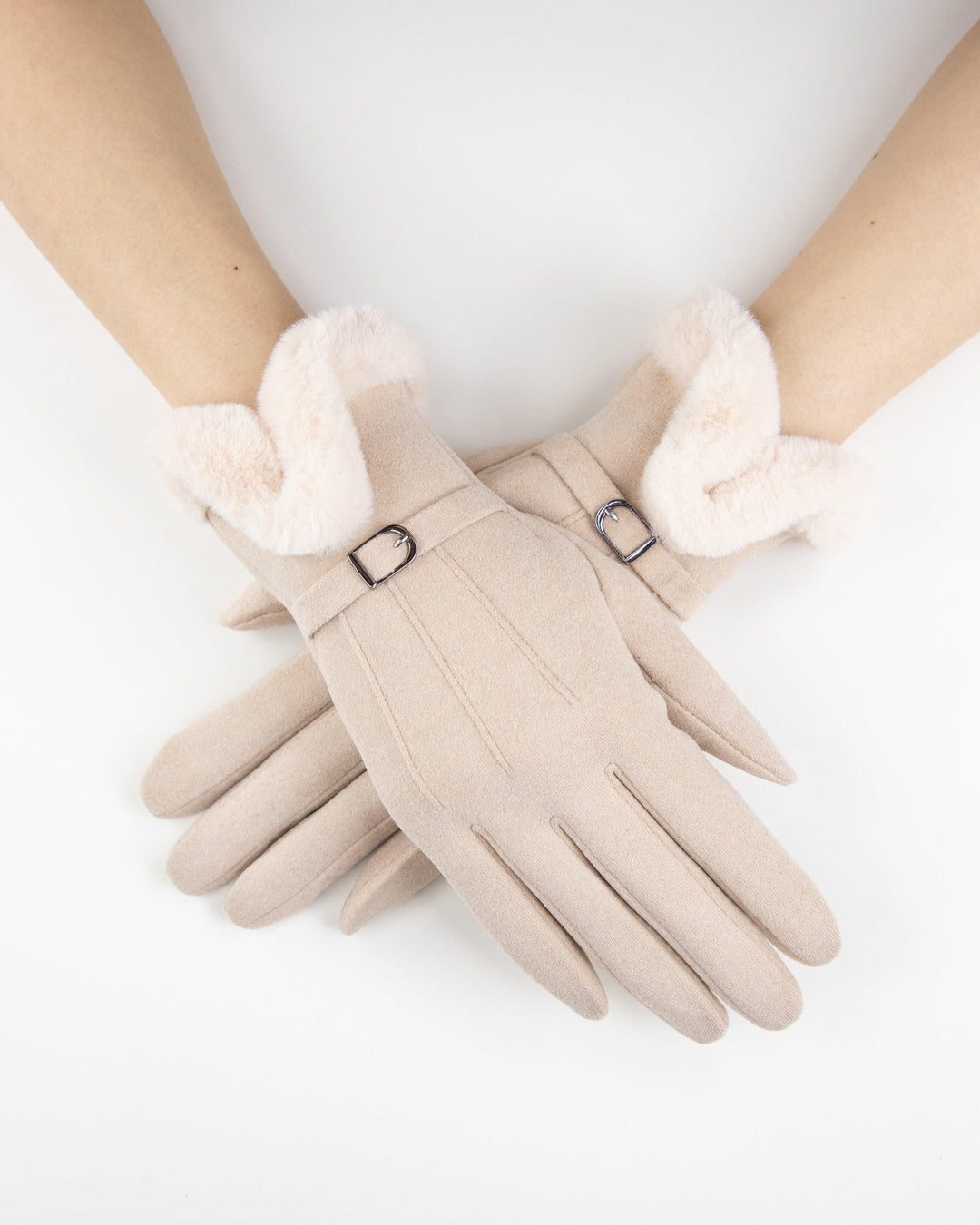 Beige bouclé gloves with plush contrast cuff trim and silver buckle detail, worn on hands.