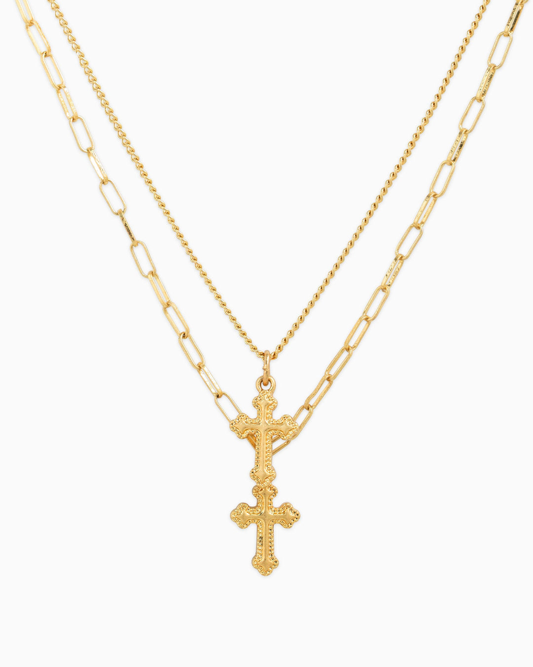 Gold two-layer necklace set with ornate double cross pendant on chain and paperclip chain