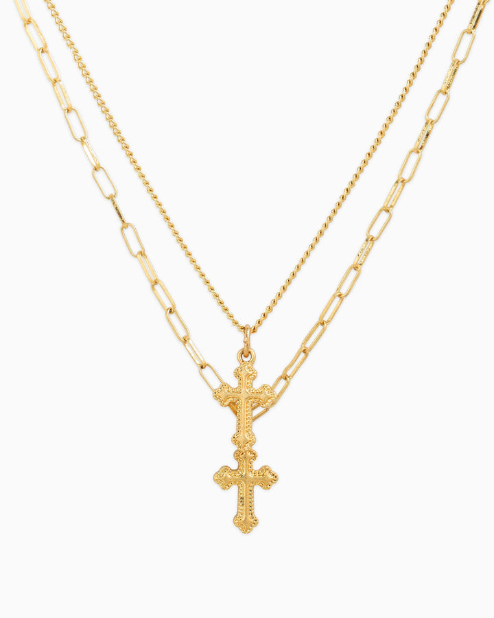Gold two-layer necklace set with ornate double cross pendant on chain and paperclip chain