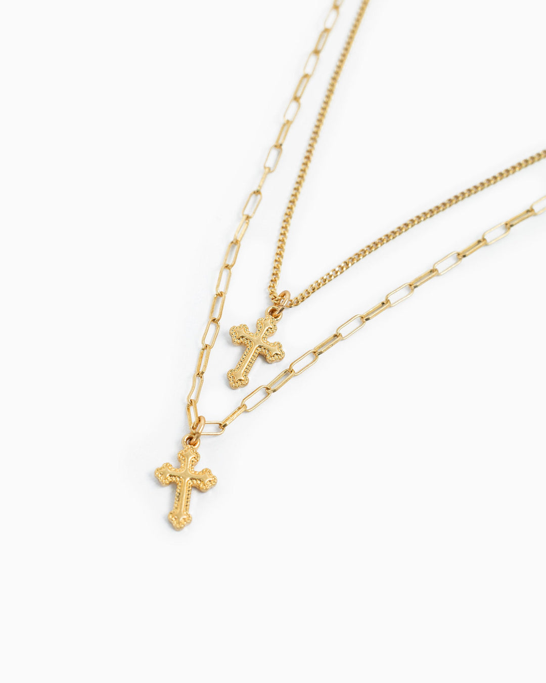 Gold layered double cross necklace with curb chain and paperclip chain pendants