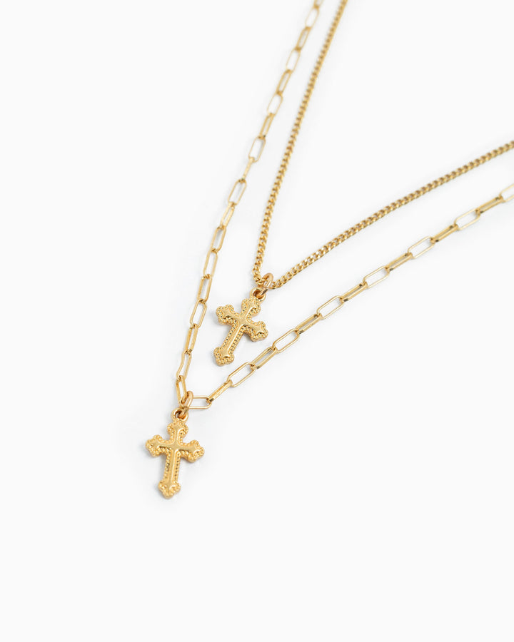 Gold layered double cross necklace with curb chain and paperclip chain pendants