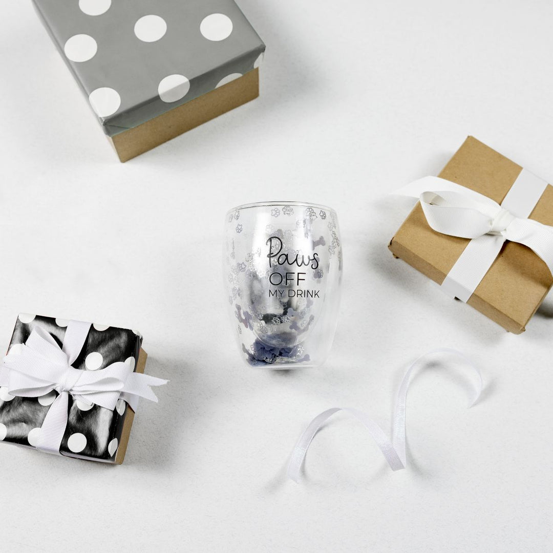 Clear stemless wine glass with gray paw prints and 'Paws Off My Drink' text