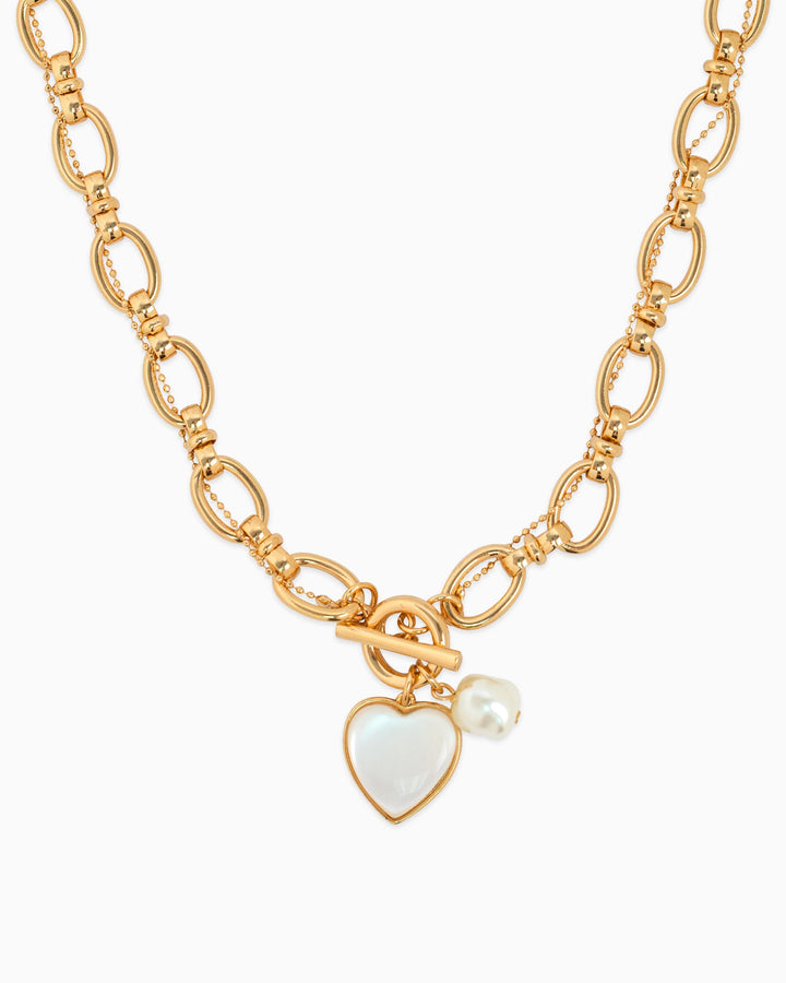 Gold twist chain toggle necklace with mother-of-pearl heart charm and freshwater pearl pendant