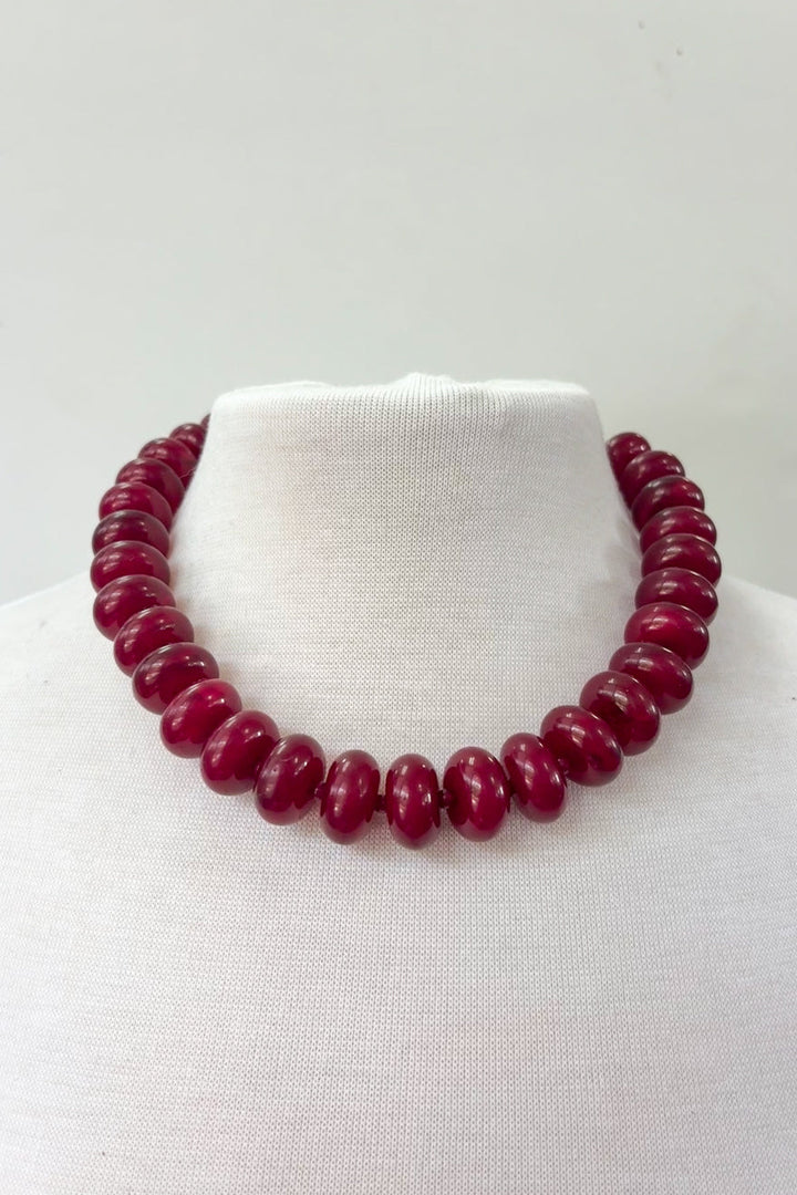 Dylan Jewelry Hallie Necklace with deep red rondelle beads on white mannequin