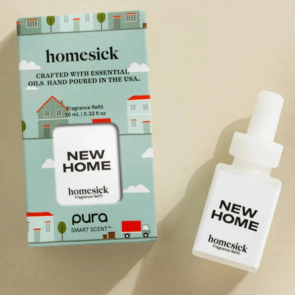 Pura homesick New Home fragrance refill vial with illustrated packaging showing houses and clouds