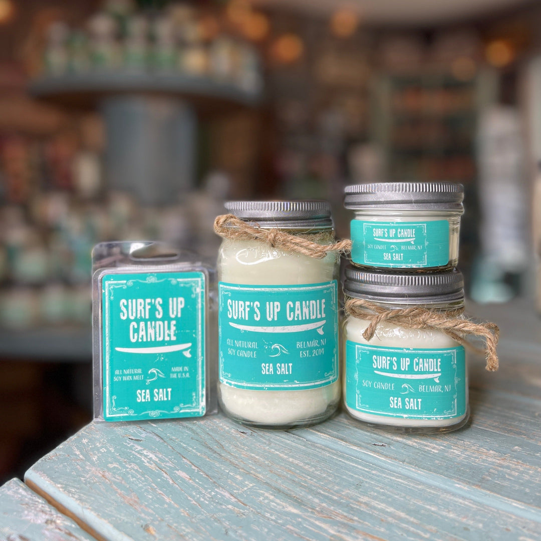 Surf's Up Candle Sea Salt scented soy candle in glass mason jar with teal label