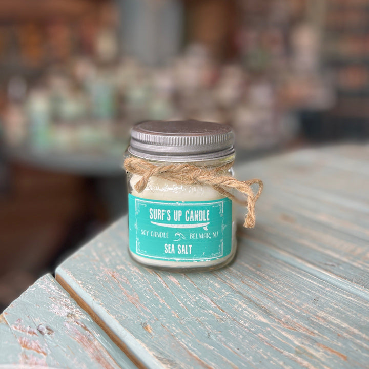 Surf's Up Candle Sea Salt soy candle in a mason jar with teal label and twine bow