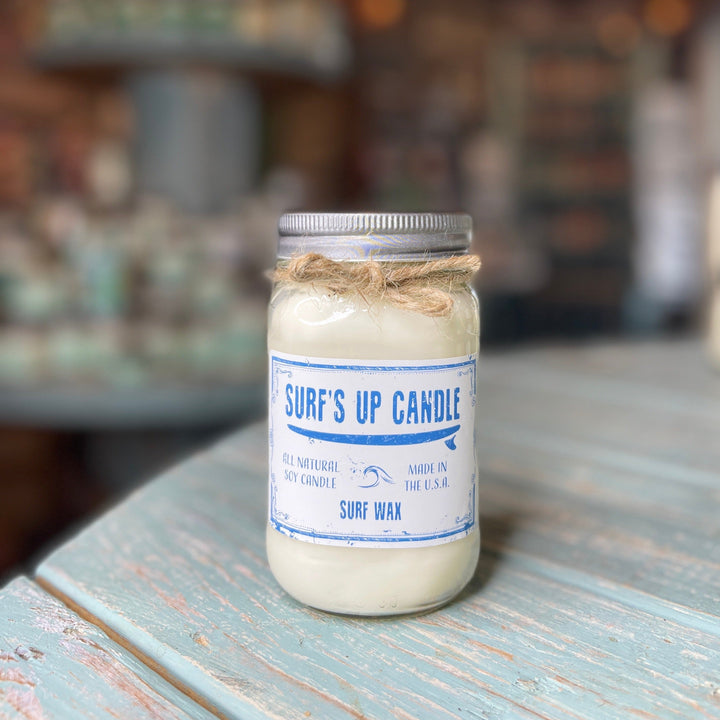 Surf's Up Candle Surf Wax scented soy candle in a mason jar with silver lid.