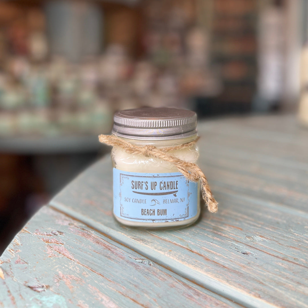 Surf's Up Candle Beach Bum soy candle in small mason jar with metal lid and twine bow.