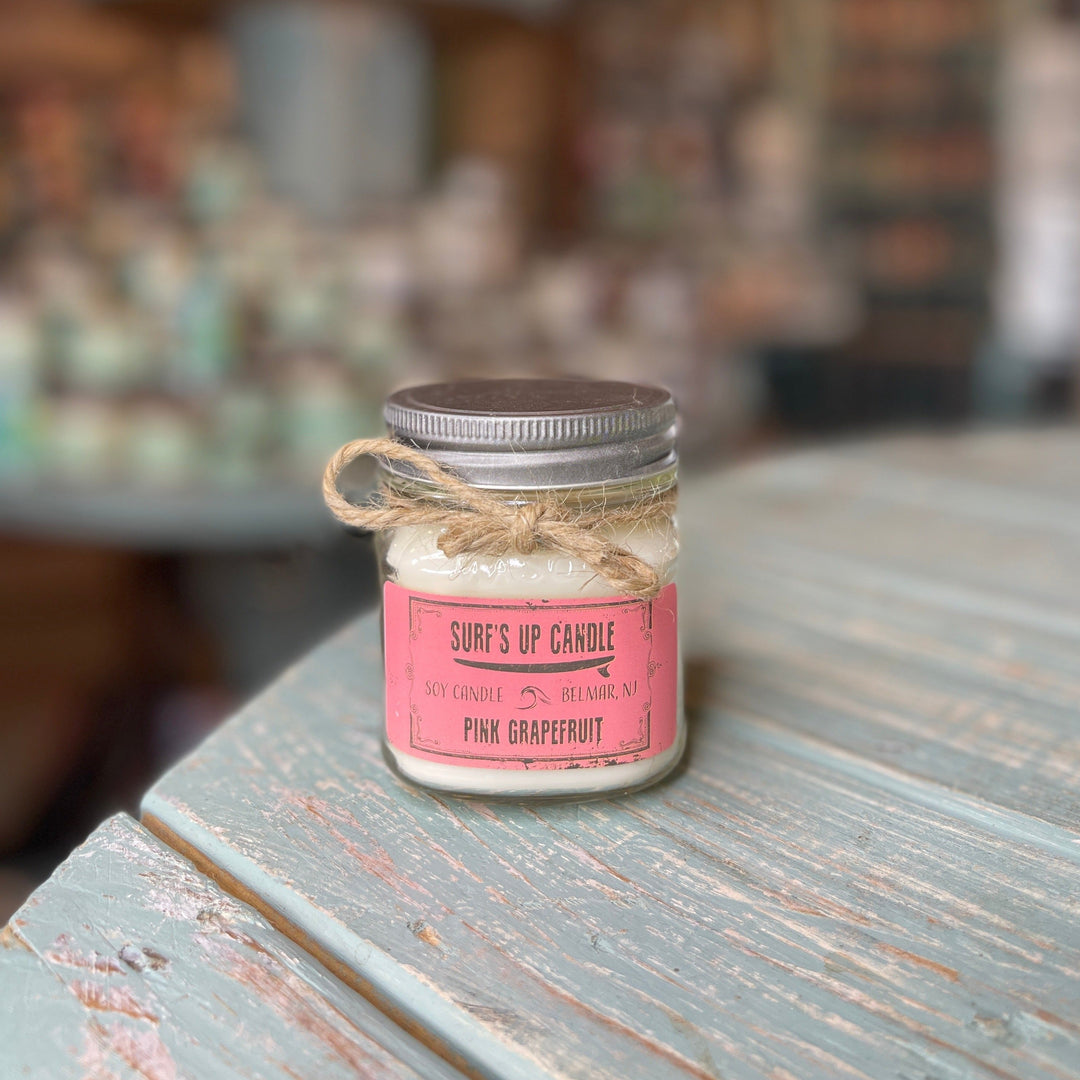 Surf's Up Candle Pink Grapefruit soy candle in small mason jar with metal lid and twine bow