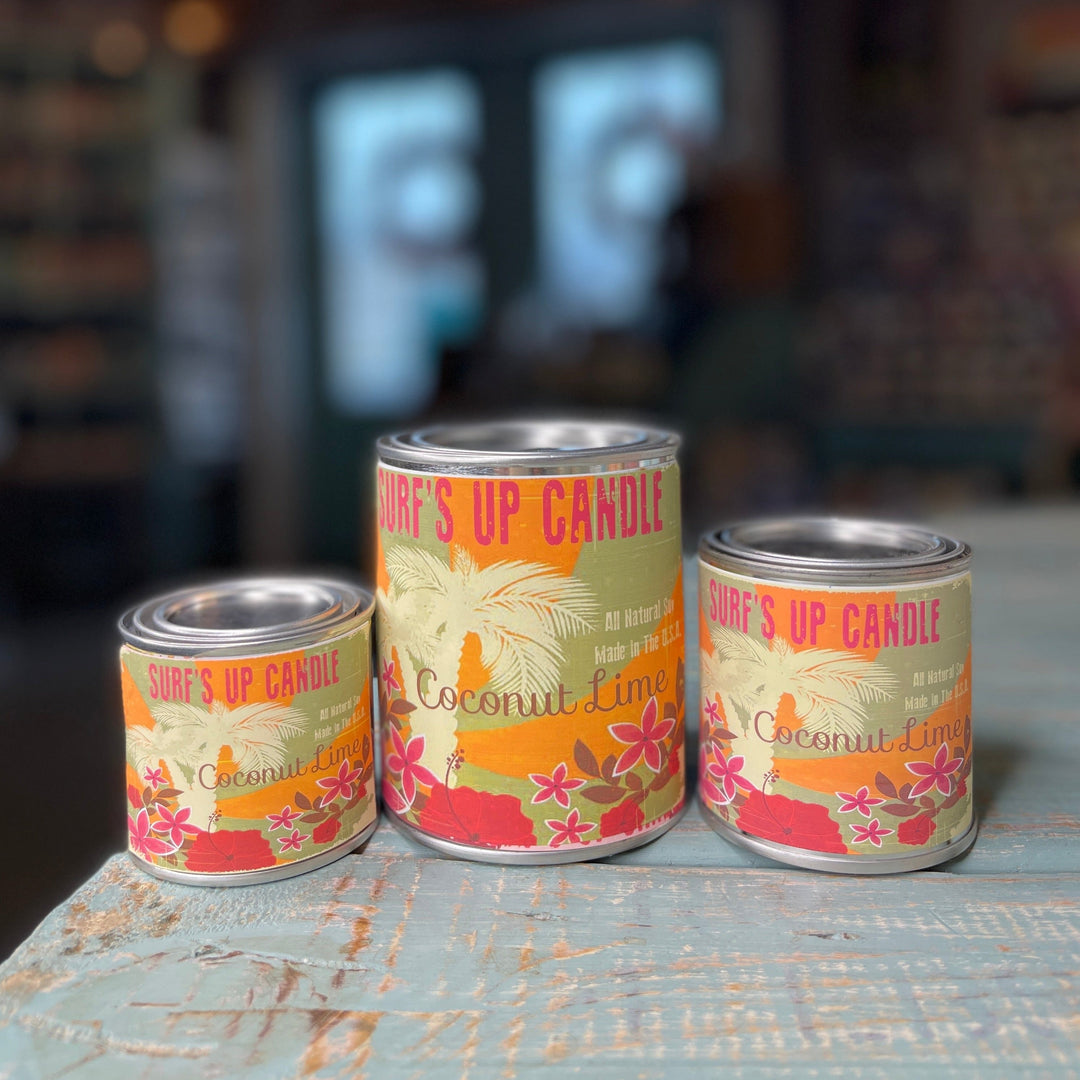 Surf's Up Candle Coconut Lime Paint Can Candle in three sizes on rustic surface
