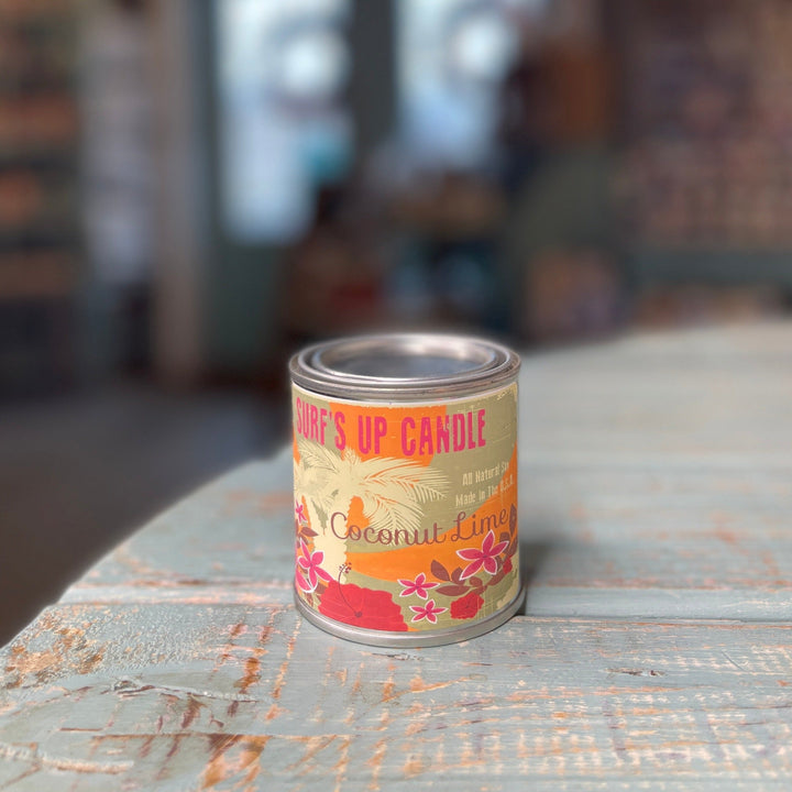 Surf's Up Candle Coconut Lime scented soy candle in a tropical-labeled paint tin.