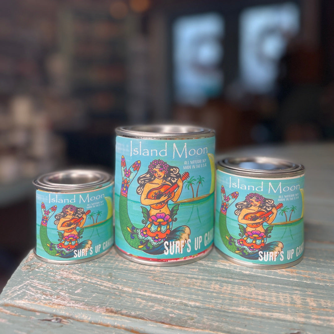 Island Moon Paint Can Candle by Surfs Up Candle in three sizes on rustic surface