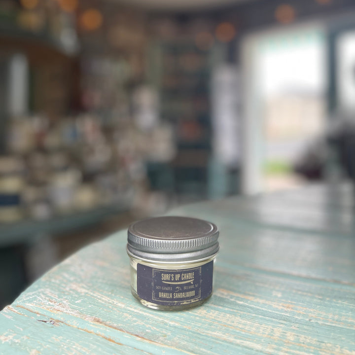 Surf's Up Candle Vanilla Sandalwood soy candle in a small mason jar with metal lid