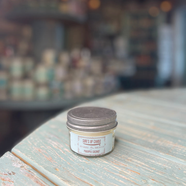 Surf's Up Candle Pineapple Coconut soy candle in small glass mason jar with silver lid