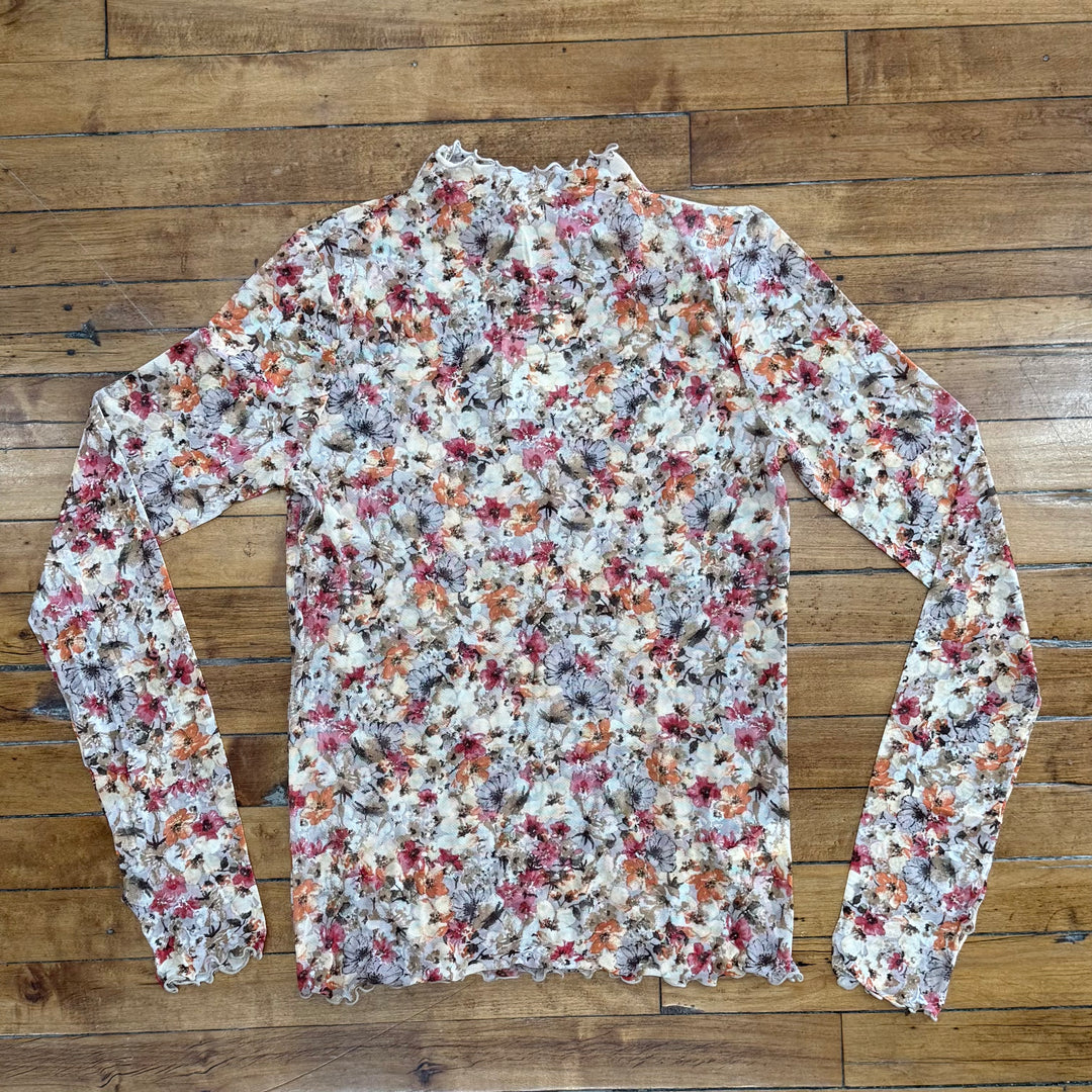 "Women’s see-through top – soft fabric with true-to-size fit, perfect for layering with a light and elegant look."

