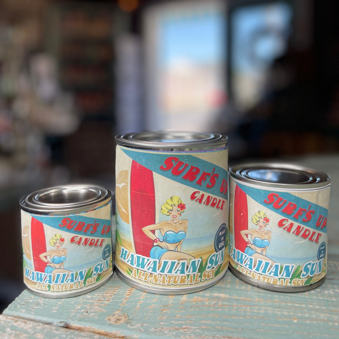 Surf's Up Candle Hawaiian Sun all-natural soy paint can candles in three sizes on rustic surface