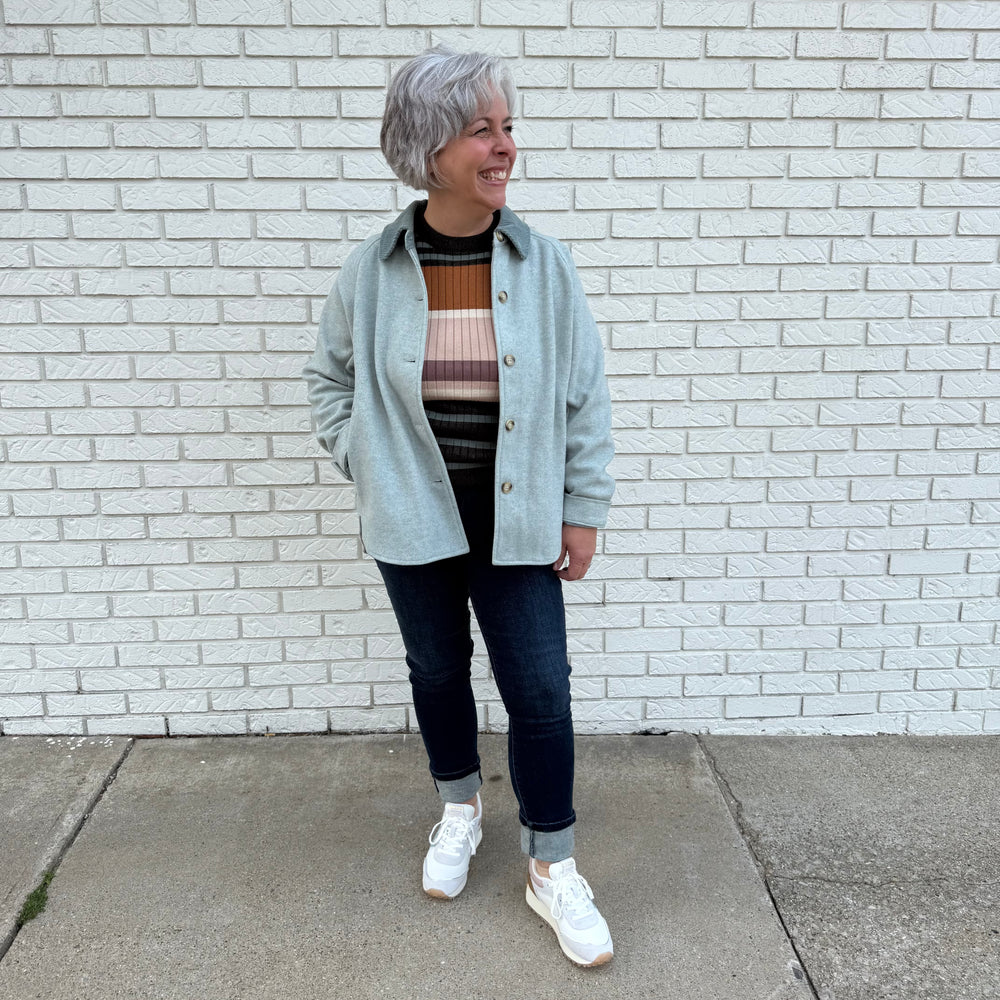 Fitted women’s ribbed knit top with long sleeves and a crew neck – model Becky wears a medium, fits true to size.

