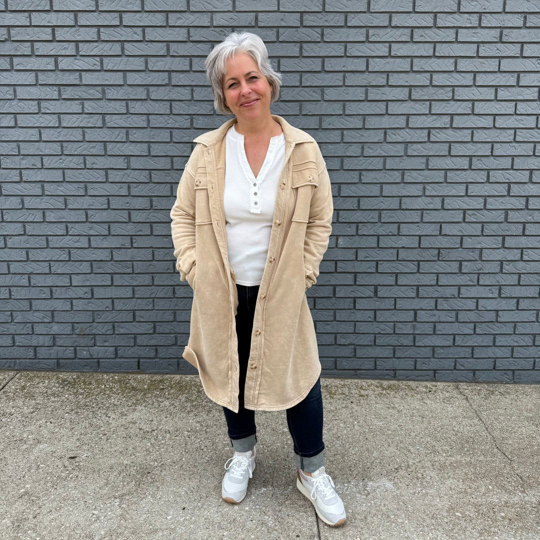 Women's button-down shirt with side pockets, buttoned chest pockets, and a flattering hi-lo hem – model Becky wears size small.

