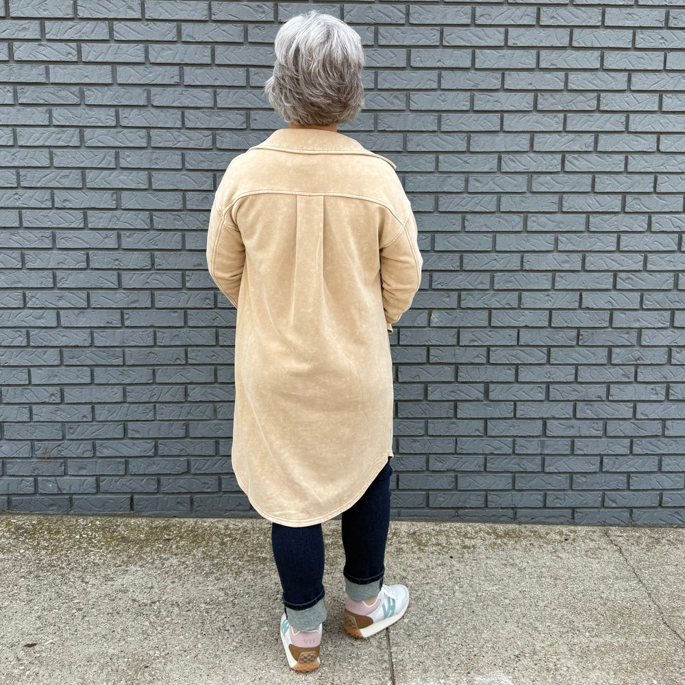 Women's button-down shirt with side pockets, buttoned chest pockets, and a flattering hi-lo hem – model Becky wears size small.

