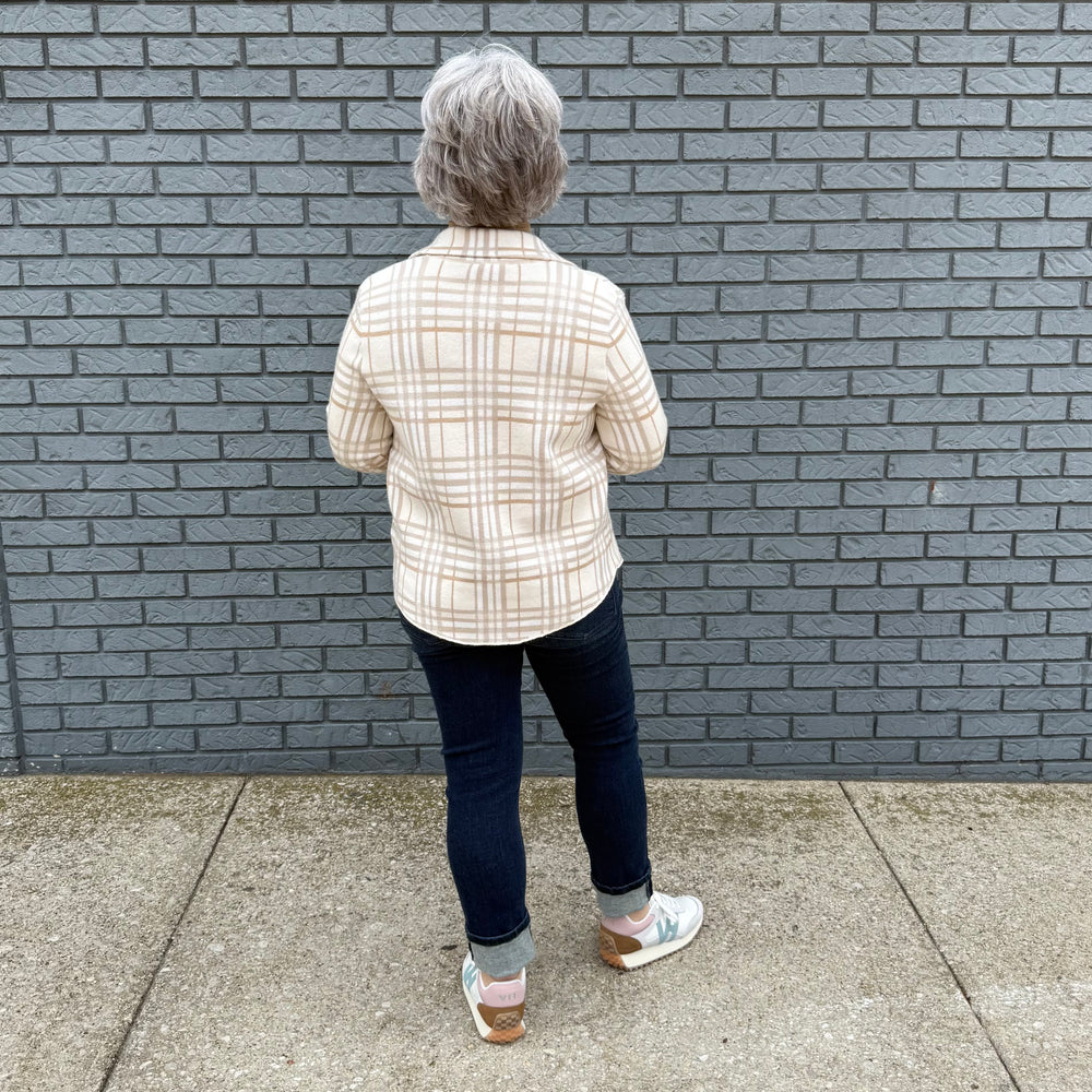 Women's button-down shirt with chest pockets and a hi-lo hem – model Becky wears a medium, fits true to size.

