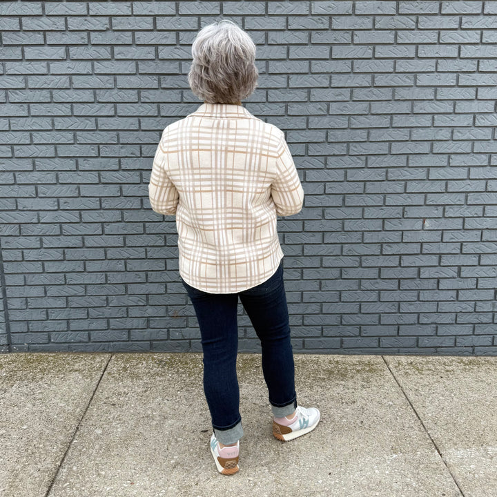 Women's button-down shirt with chest pockets and a hi-lo hem – model Becky wears a medium, fits true to size.

