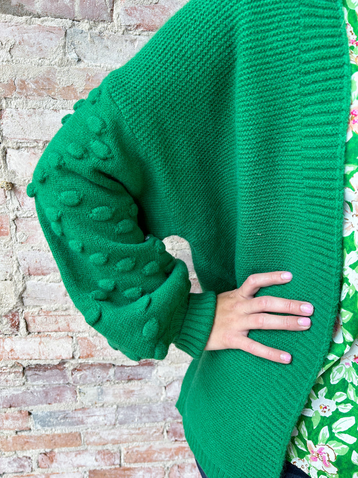 open cardi with pom pom detail