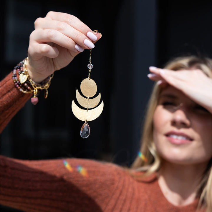 Scout Mini Suncatcher in Lunar colorway featuring gold crescents and black crystal teardrop