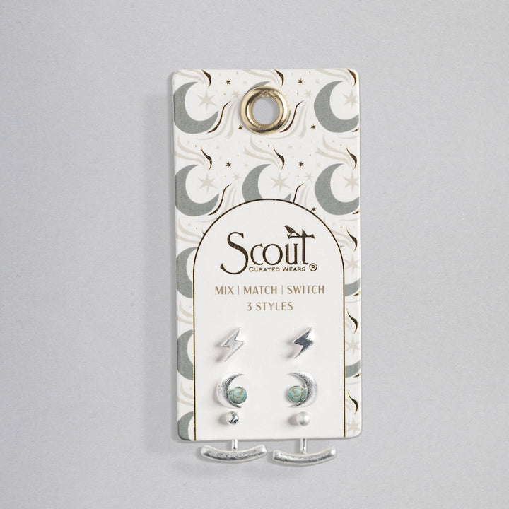 Scout Stud Trio Jacket Set with lightning bolts, turquoise stones, and silver crescents on celestial packaging