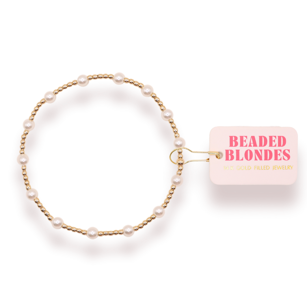 Beaded Blondes June Pearl Bracelet featuring gold beads and white pearl accents on display card