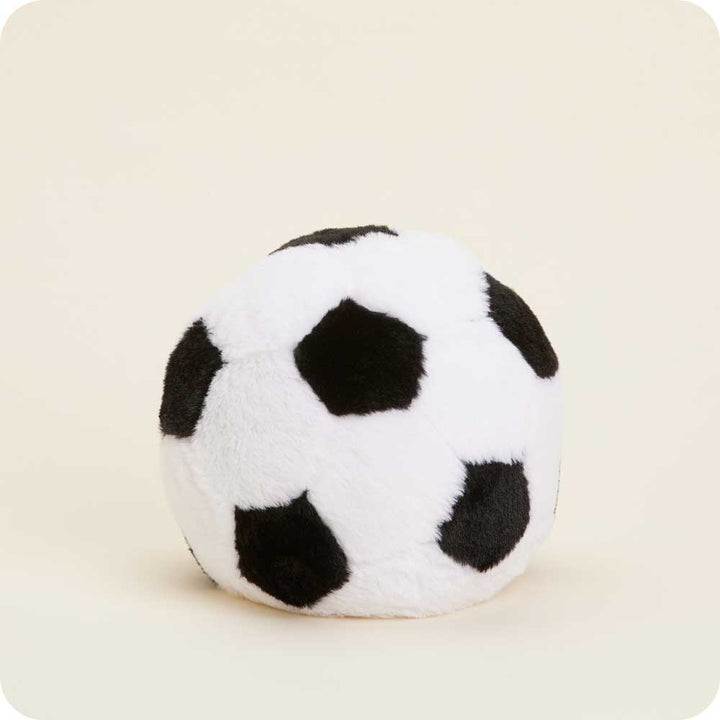 Warmies plush soccer ball shaped heating pad with white and black pentagon pattern