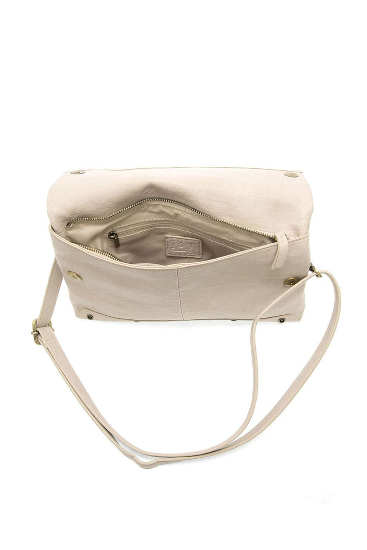 Light beige convertible crossbody bag shown open with interior compartments and adjustable strap