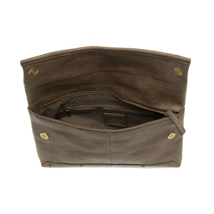 Brown leather fold over crossbody bag shown open displaying interior compartments and zipper