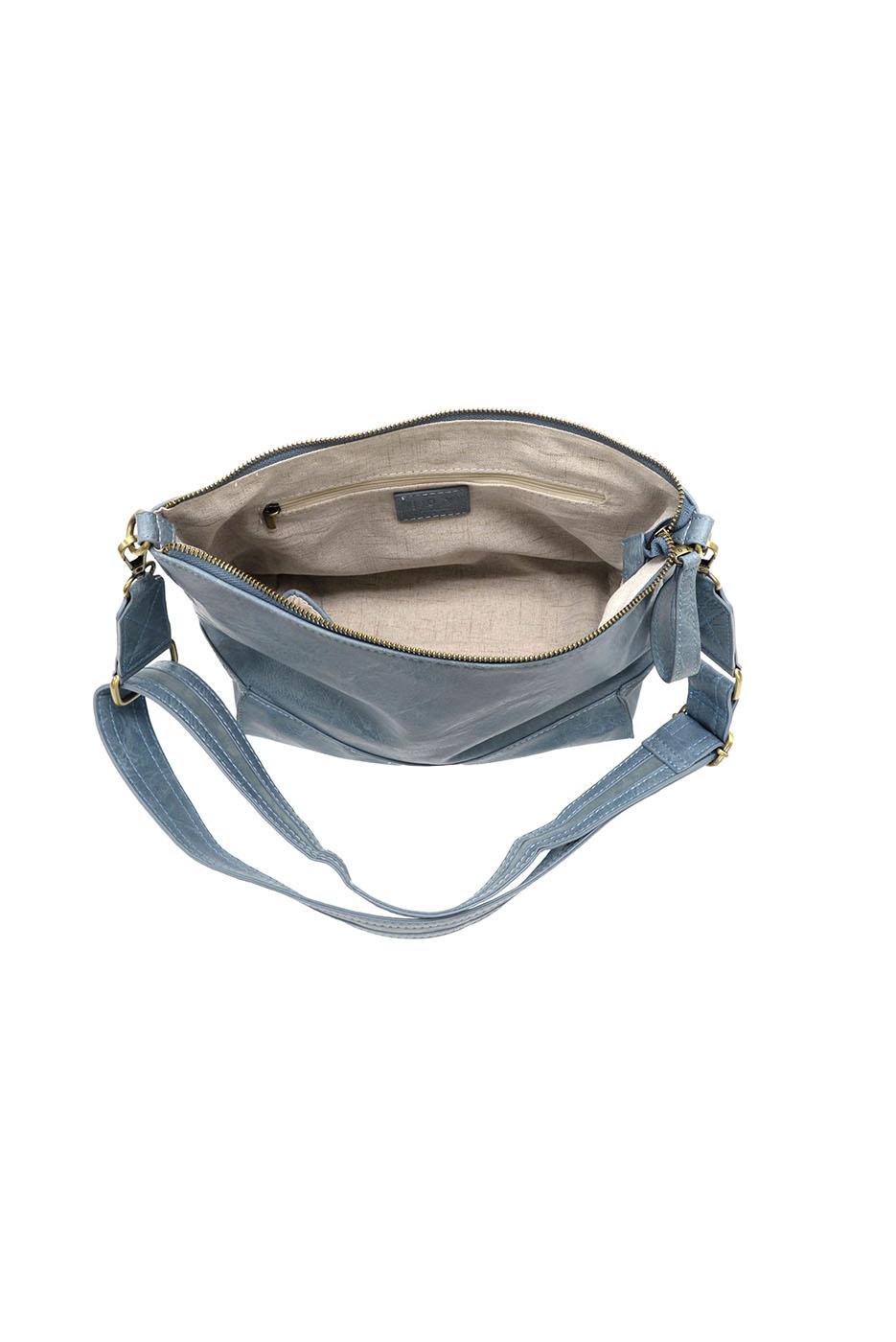 Chambray blue crossbody bag with geometric seamed design and adjustable strap, interior view shown
