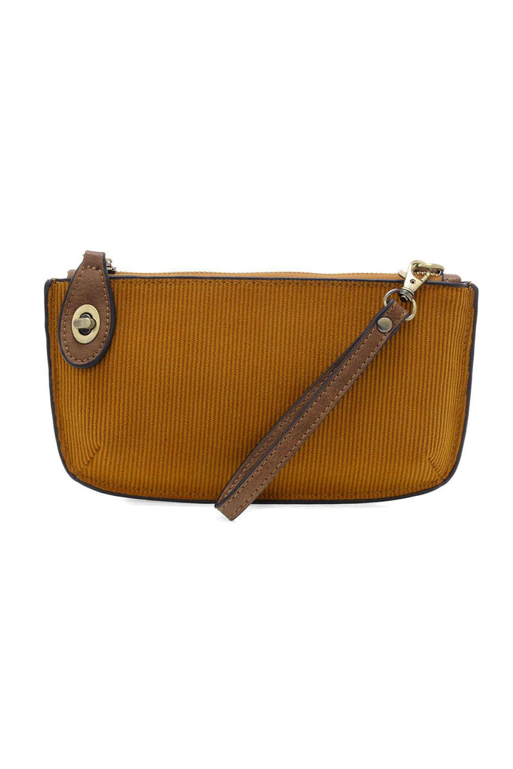 Mustard yellow corduroy mini crossbody wristlet with brown leather trim and wrist strap