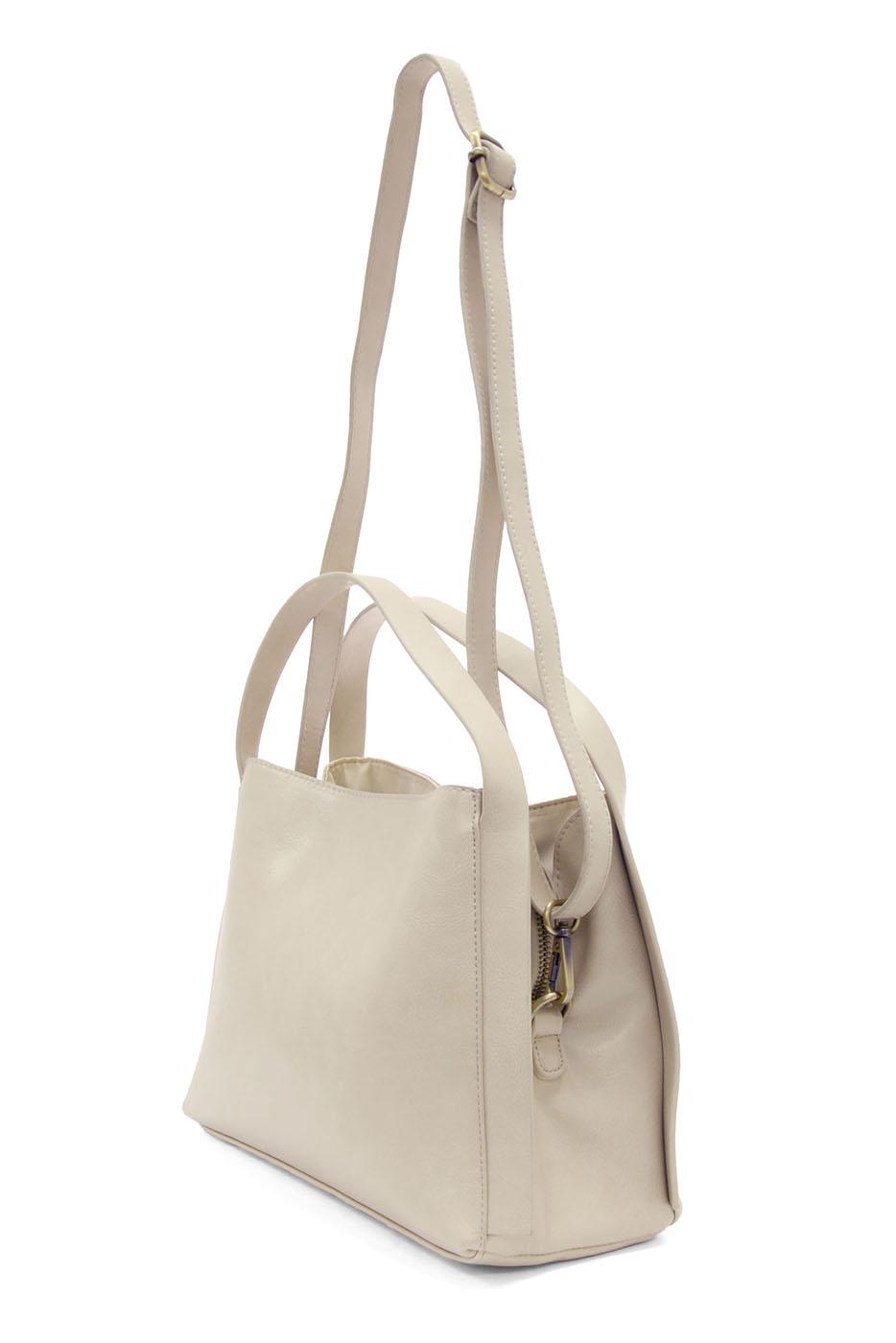 Light beige leather satchel crossbody bag with dual handles and adjustable shoulder strap