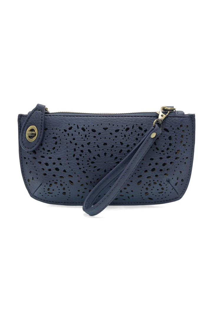 Navy blue laser cut eyelet mini wristlet crossbody clutch with perforated pattern and wrist strap
