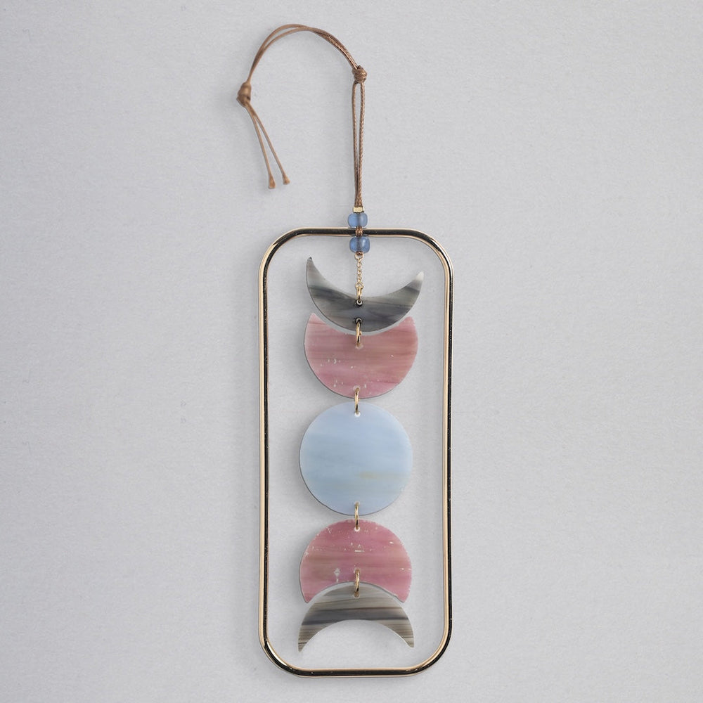 Scout stained glass light catcher with moon phase design in gray, pink and blue crescents